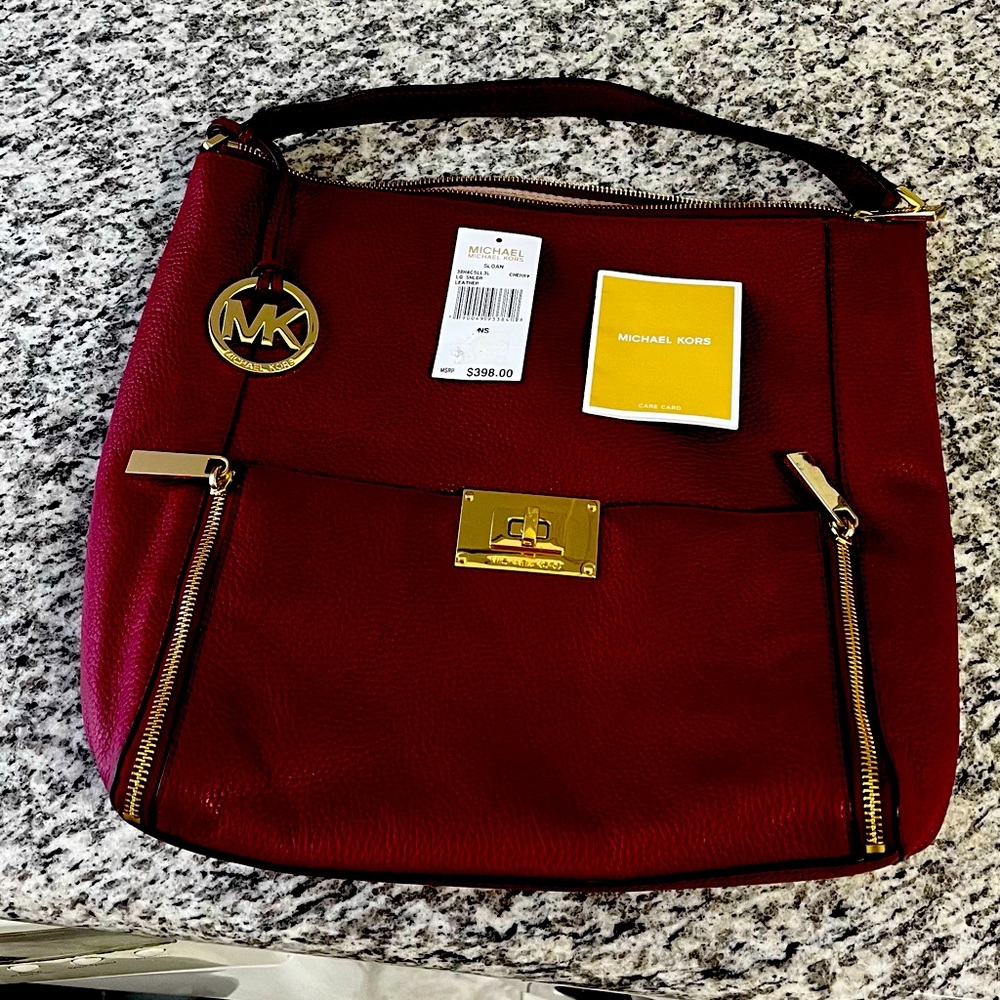 - Authentic Michael Kors Cherry red pebbled leather handbag . Medium size